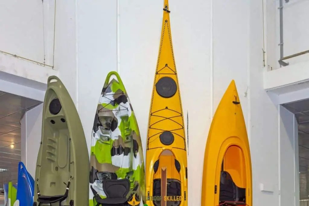 plastic kayaks vertically to show why are plastic kayaks good