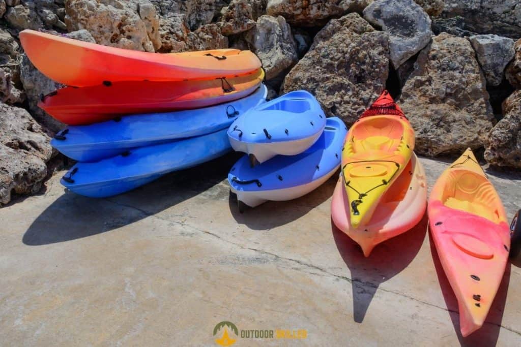 colorful kayaks to show how to store a fiberglass kayak