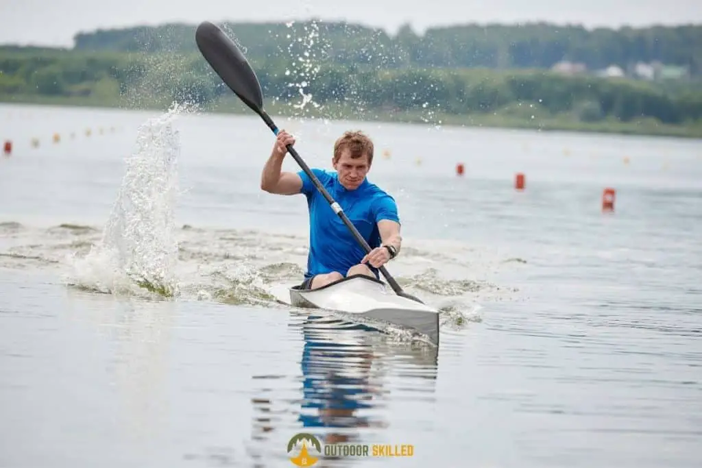 man kayaking to show what makes a kayak track straight