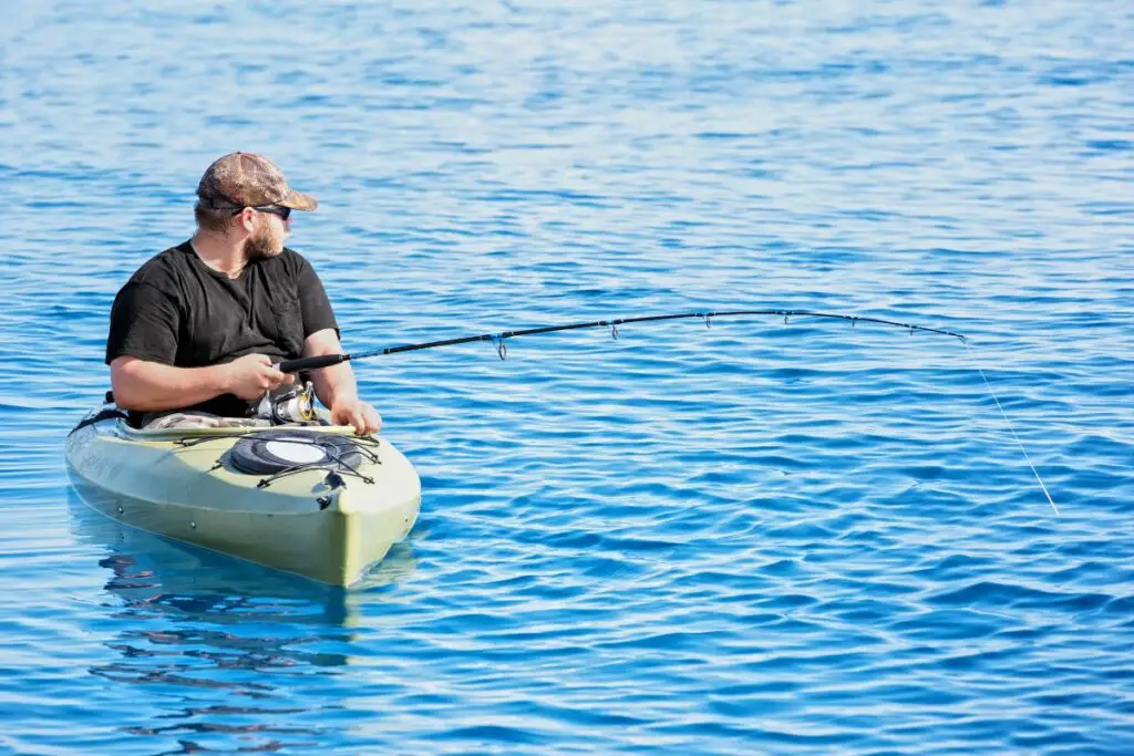 a photo of an angler in a kayak to show the best modular fishing kayak
