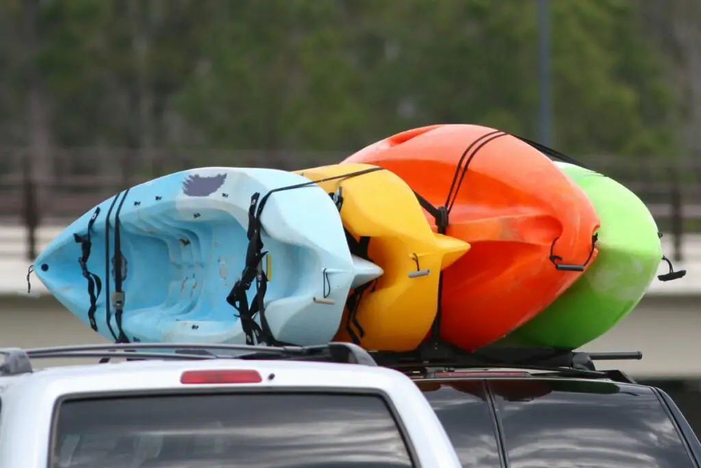 a picture of kayaks on a car roof to answer can you get 3 kayaks on a roof rack