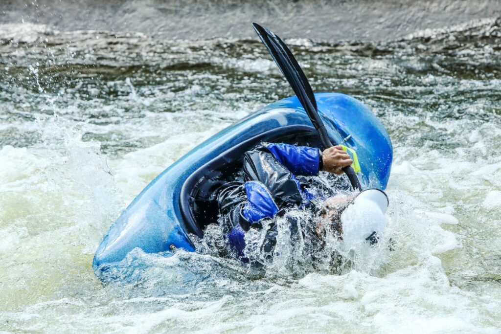 a photo of a kayak capsizing to answer is kayaking dangerous