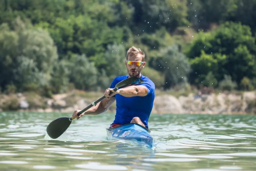 a photo of a fit kayaker to answer does kayaking help lose belly fat