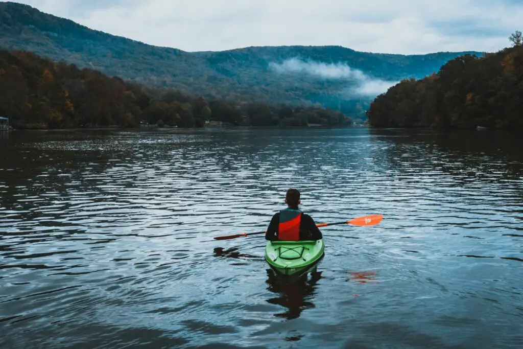 a photo of a kayaker on a lake to answer is kayaking on a lake dangerous