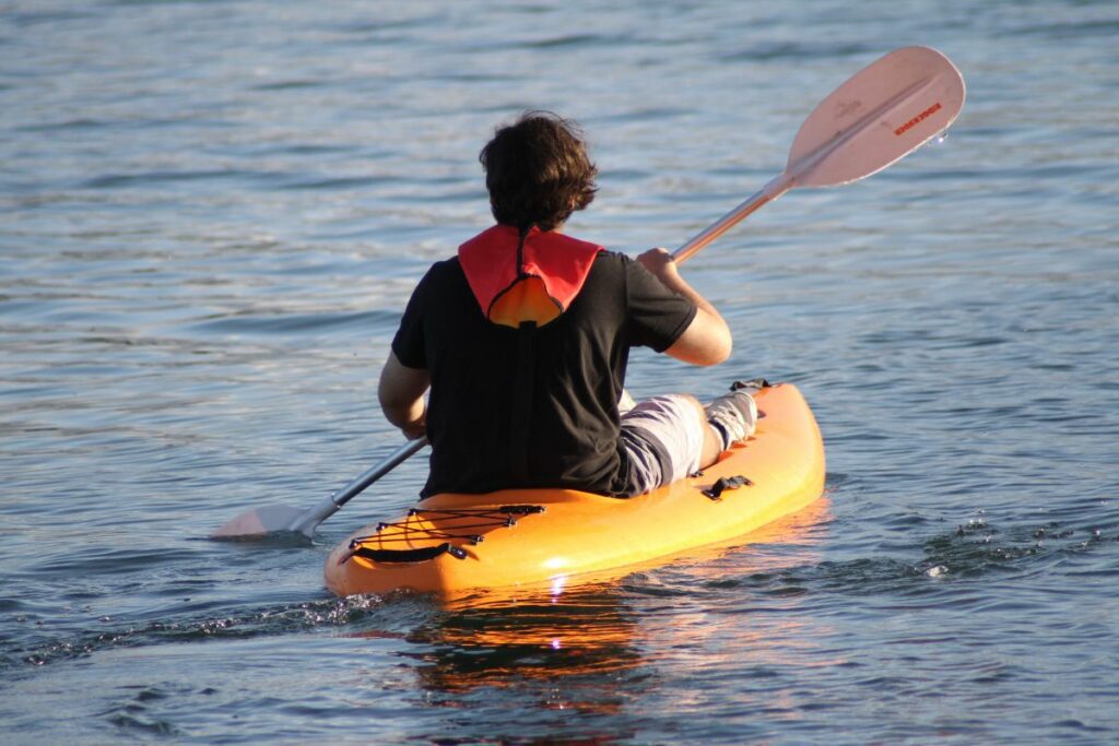 a photo of a kayaker to answer can you learn to kayak by yourself