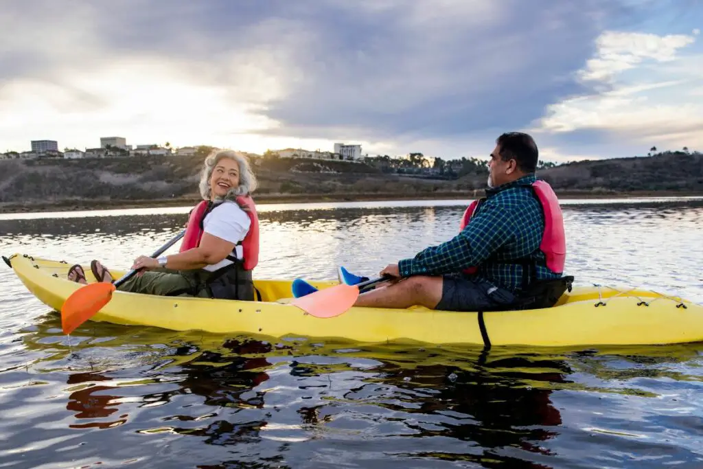 a photo of overweight people kayaking to answer is there a weight limit for kayaking